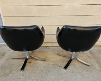 Pair of Mid Century Modern "Stowe & Davis" black leather & chrome swivel chairs.