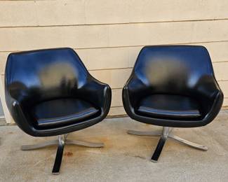 Pair of Mid Century Modern "Stowe & Davis" black leather & chrome swivel chairs.