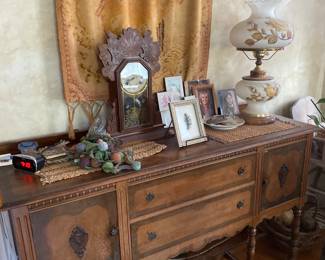Sideboard, mantle clock, lamp
