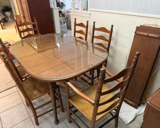 Vintage dining table with six chairs and glass top