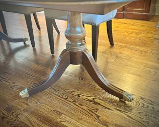 Henredon dining table with brass feet