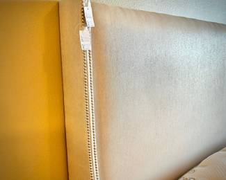 Stearns & Foster upholstered king bedframe with nailhead trim, and Stearns & Foster mattress and box spring set.