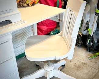 White desk, desk chair, and nightstand
