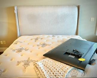 Stearns & Foster upholstered king bedframe with nailhead trim, and Stearns & Foster mattress and box spring set.