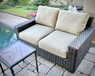 Outdoor woven loveseat.