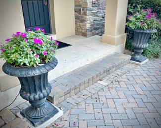 Two black lightweight planters with flowers. Two without flowers are also available.