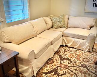 Pottery Barn L-shaped off-white sofa and Ralph Lauren Home oriental rug