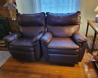 Two very nice brown leather recliners. 