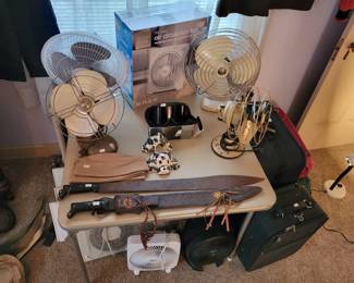 Antique fans and WWII machetes.