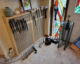 Golf clubs and a set of irons.