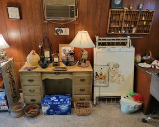 Desk and vintage baby crib.