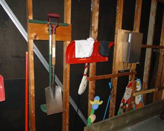 A variety of shovels and other yard items to, for working around the yard, or decorating the yard, your choice, or both