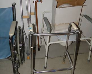 Pair of crutches, walker, another style and size, and another medical chair too