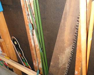 Vintage saw and tomato poles. Or, you can use the poles for Green Peppers, it doesn't matter