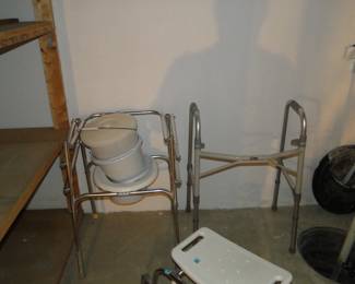 Large looming shadow over-seeing some medical seats, and walkers