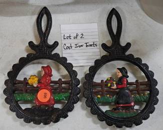 TWO CAST IRON TRIVETS