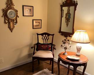 Barometer, mirror, arm chair, table, lamp, floral candelabra 