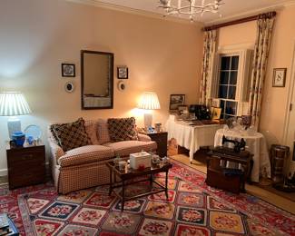 Loveseat, coffee table, Mottahedeh porcelains, campaign style side tables and mirror, lamps