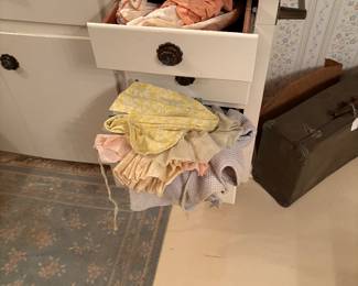 We have several boxes of vintage children’s clothing.