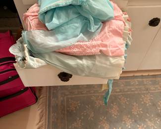 We have several boxes of vintage children’s clothing.