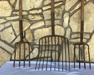 10-tine pitchfork and two 4-tine hay forks