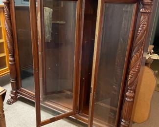 	#63	SC - Antique 3 Door Glass Bookcase/Curio Display Cabinet (no shelves) w/claw foot and carved wood.	$350.00																											