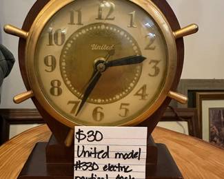 	#136	United Model #330 Electric Nautical Clock *working*	$30.00																											