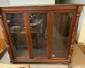 	#63	SC - Antique 3 Door Glass Bookcase/Curio Display Cabinet (no shelves) w/claw foot and carved wood.	$350.00																											