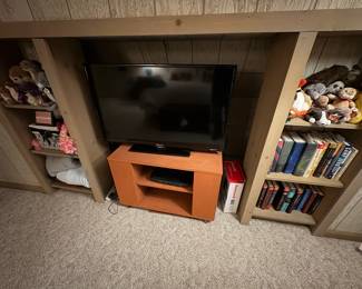 . . . another flat-screen TV and TV stand