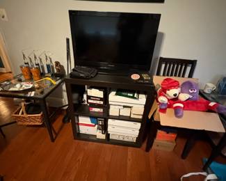 . . .  another flat-screen TV and stand