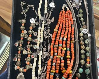 Ethnic Beads, all silver is tested: Yemeni or Ottoman silver and coral necklace, Yemeni silver and MOP necklace, Guatemalan Milagro necklace with 1860s coin, Early Moroccan coral beads with old amazonite and amber, a Rajasthani belt or necklace, Tibetan turquoise necklace.