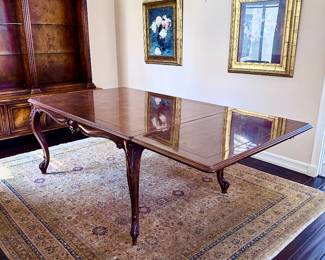 Bau Design Dining Table shown with one leaf on end 