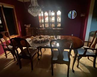 Cherrywood dining room table with 2 removable leaves, approx 84" x 42" at full length including the 2 extensions, each of which is 12" - hence, can be reduced to 60" in length $300.  If you purchase the table, the china hutch is free.