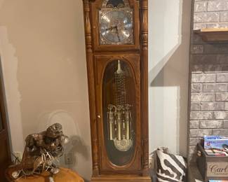 Howard Miller Grandfather Clock, perfect condition.  Lighted withnglorious chimes.  $900
