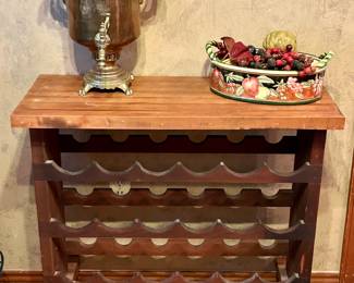 Great rolling wine rack and antique brass tea/coffee carafe warmer