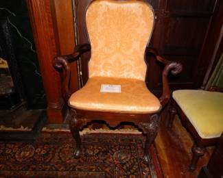 THis is a Great Antique Chair w/ Open arms that are Curved and terminated in Caved Eagle Heads.  The Knees or the Carbiolle Legs are Also Carved.Almost Queen Ann
