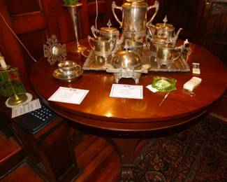 Unusal To FInd a VIctorian 9 Pc C offee and Tea Serice Even Down to  The Waste Bowl & Lidded BUtter Dish. I't Resting on an American Empire Center Table of mahogany.An Acanthus Carved massive Singe Colum & 4 Feet