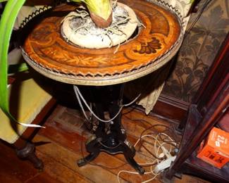 I Think THis FIn Little Table Could Be French It Has Some Ormolu & Draped Chains Plus beautiful and intricate Top inlay thereis a Hold in the Center to House a Plant. The Faux Orchid Stays w/ Me!