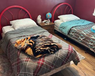 Cute red twin bed frames and mattresses, blankets, pillows, nightstand