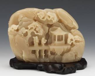A Chinese Carved Jade Mountain Boulder on Stand 