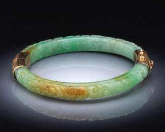 A Carved Jadeite Bangle 