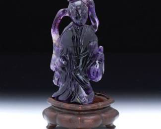 A Chinese Carved Amethyst Figure of Quanyin 