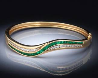 A Fine Diamond and Emerald Bangle Bracelet 
