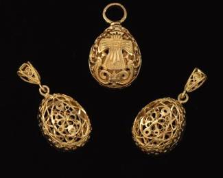 A Group of Three Gold Filigree Egg Pendants 