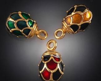 A Group of Three Enamelled Egg Pendants 