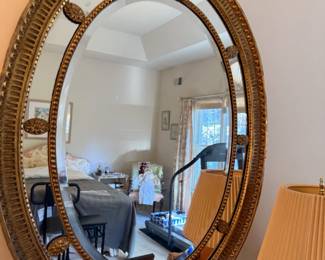 Antique oval gilt wood mirror