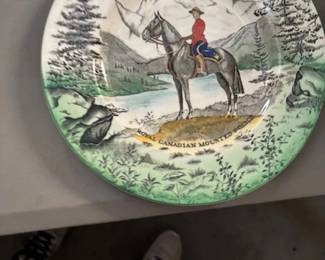     Royal Canadian Mounted Police Plate
    A decorative collector’s plate featuring an illustration of a Royal Canadian Mounted Police officer on horseback, set against a scenic mountain backdrop. A unique addition for collectors of themed ceramics.
