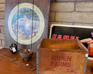 Vintage Arden Farms Crate & Accessories
A vintage wooden crate labeled “Arden Farms,” displayed with a variety of small decorative items, including a ceramic vase and rustic wall art.