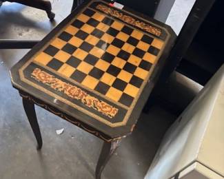 Vintage Checkerboard Table
A beautiful vintage wooden table with an intricately inlaid checkerboard pattern, ideal as both a functional game table and a decorative accent piece.