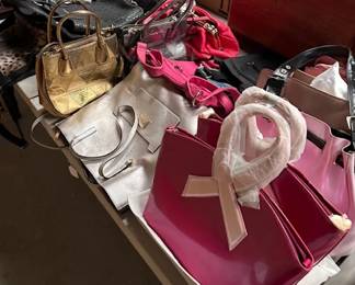     Designer Handbags Collection
    A stylish assortment of handbags, including pink, gold, and silver designs. Features a mix of designer and casual styles for a variety of occasions.